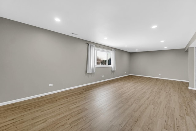 spare room featuring recessed lighting, baseboards, visible vents, and light wood finished floors