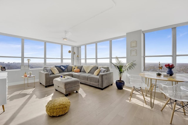 interior space with ceiling fan