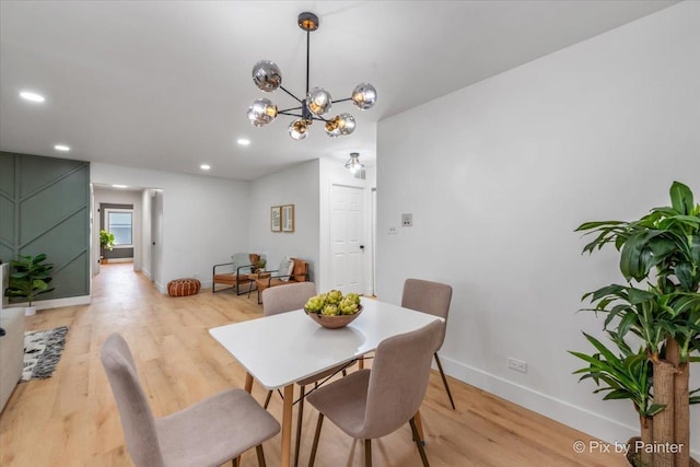 dining room with recessed lighting, light wood-type flooring, and baseboards