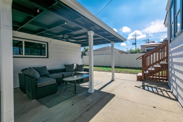 view of patio / terrace with fence, stairway, and an outdoor hangout area