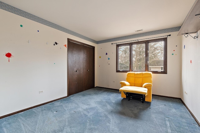 unfurnished room featuring carpet flooring, visible vents, and baseboards