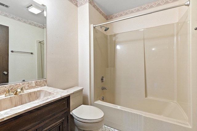 bathroom with wallpapered walls, visible vents, toilet, vanity, and shower / washtub combination