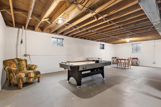 recreation room featuring concrete floors