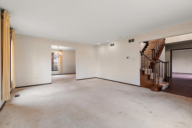 carpeted empty room with baseboards, visible vents, stairway, and a notable chandelier