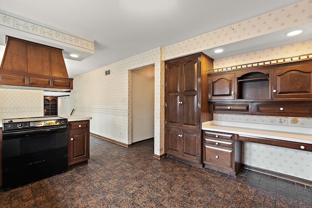 kitchen featuring black / electric stove, granite finish floor, baseboards, range hood, and wallpapered walls