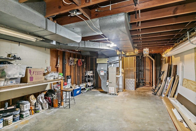 unfinished basement featuring heating unit