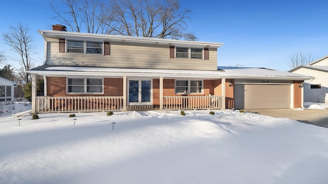 traditional-style home featuring an attached garage, covered porch, brick siding, driveway, and a chimney