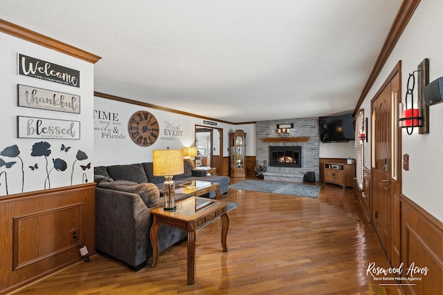 330 Fox Trl, Bourbonnais, IL 60914 - living area with wood finished floors, crown molding, a fireplace, and wainscoting