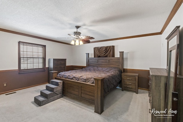 330 Fox Trl, Bourbonnais, IL 60914 - bedroom with light colored carpet, a textured ceiling, ornamental molding, a wainscoted wall, and ceiling fan