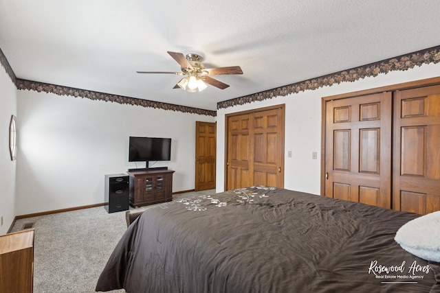 330 Fox Trl, Bourbonnais, IL 60914 - bedroom featuring carpet floors, baseboards, two closets, and a ceiling fan