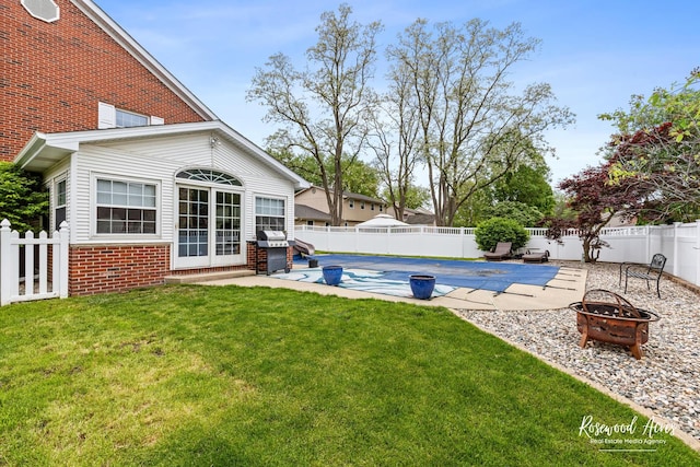 330 Fox Trl, Bourbonnais, IL 60914 - view of yard featuring a fire pit and a patio