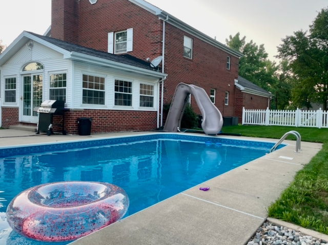 330 Fox Trl, Bourbonnais, IL 60914 - view of pool featuring a water slide, a patio area, and a grill