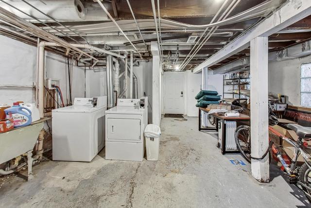 unfinished basement featuring washing machine and clothes dryer