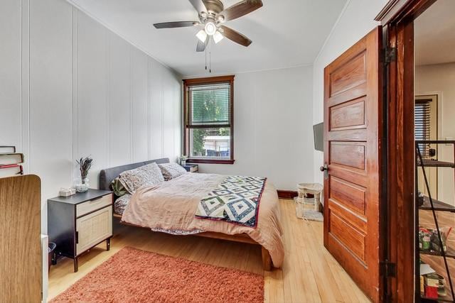 bedroom featuring a ceiling fan and light wood finished floors