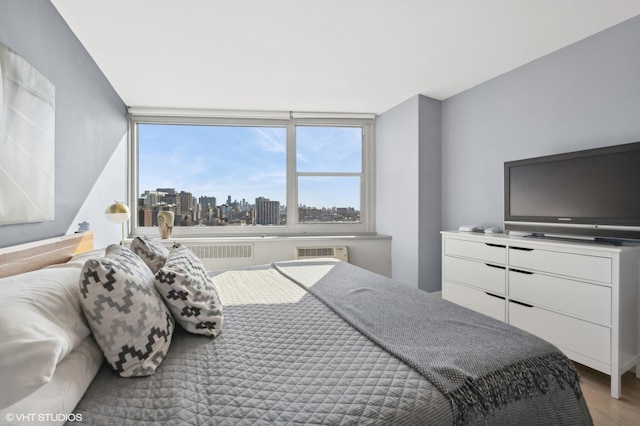 bedroom featuring wood finished floors