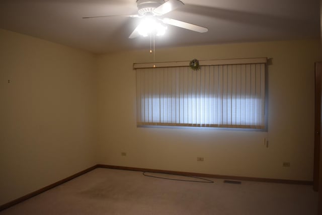 10600 Lynn Dr, Orland Park, IL 60467 - carpeted spare room featuring visible vents, baseboards, and a ceiling fan