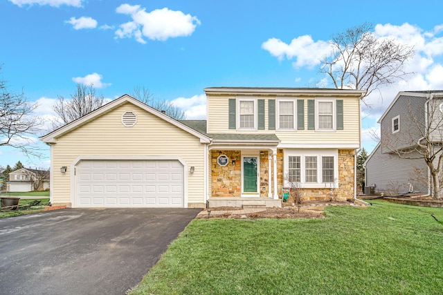 view of front of property featuring aphalt driveway, a front yard, stone siding, and an attached garage