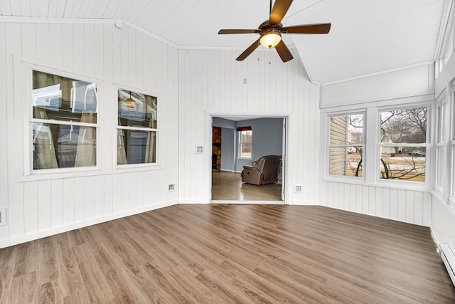 unfurnished sunroom with a baseboard radiator, ceiling fan, and vaulted ceiling