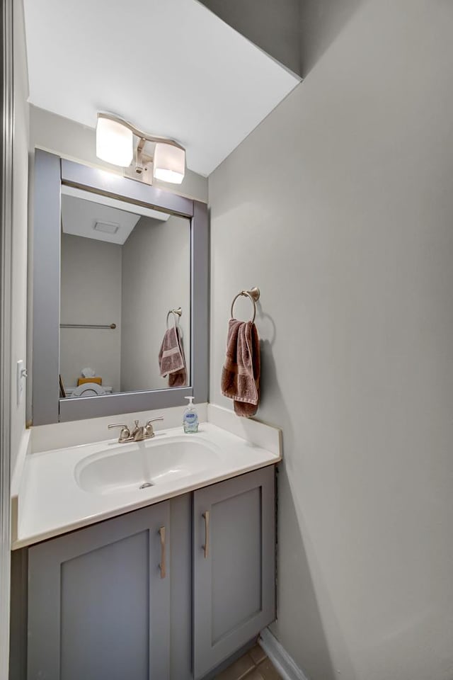 bathroom featuring baseboards and vanity