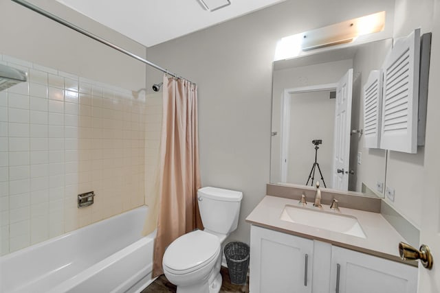 full bath with shower / tub combo, vanity, and toilet