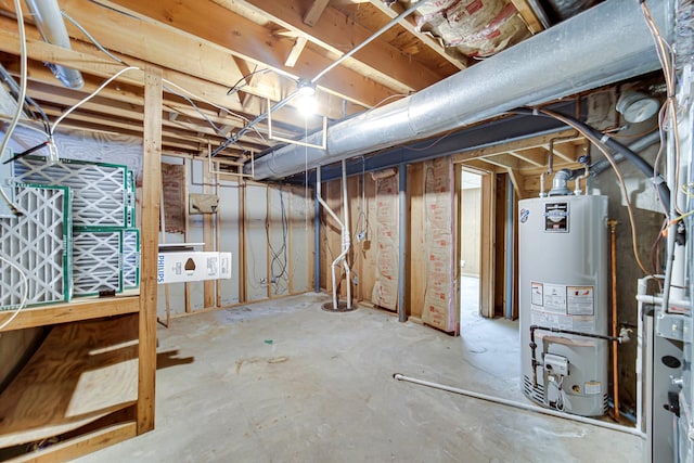 unfinished basement featuring water heater