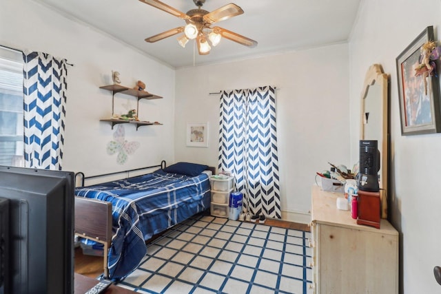 bedroom with crown molding and ceiling fan