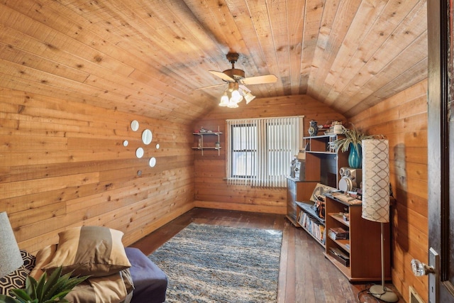 living area featuring dark wood-style floors, wood walls, vaulted ceiling, and wood ceiling