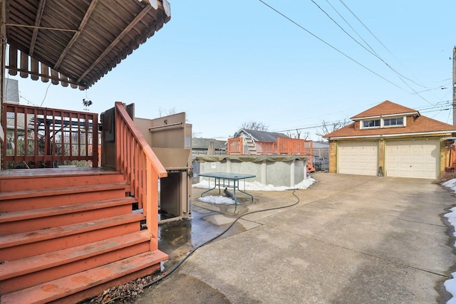 exterior space with a garage, an outbuilding, a fenced in pool, and stairs