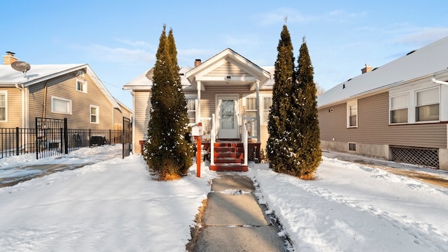 view of front of house featuring fence