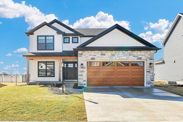 view of front of home with concrete driveway, fence, a garage, stone siding, and a front lawn