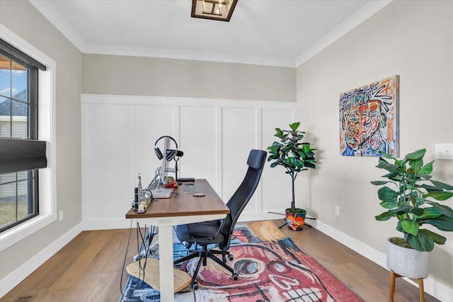 office space with baseboards, ornamental molding, and wood finished floors