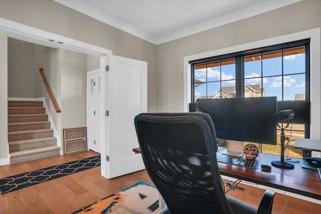 office space featuring ornamental molding, wood finished floors, and visible vents