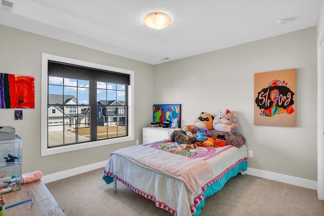 bedroom featuring visible vents and baseboards