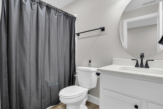 bathroom featuring visible vents, toilet, vanity, wood finished floors, and a shower with curtain