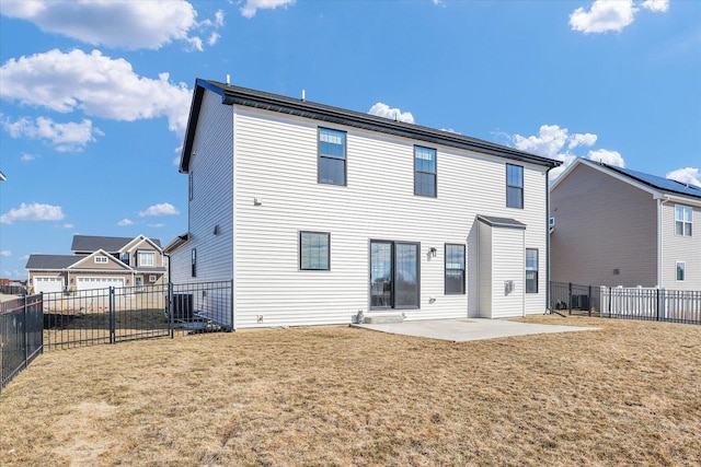 rear view of house featuring a fenced backyard, cooling unit, a patio, and a yard