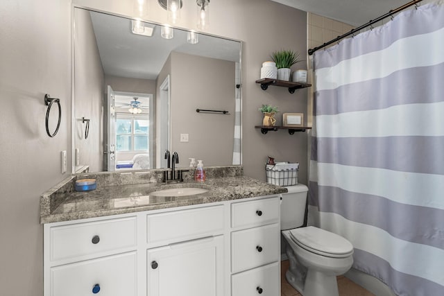 full bath featuring toilet, a shower with curtain, and vanity