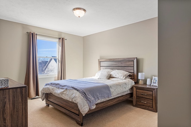 bedroom featuring light colored carpet