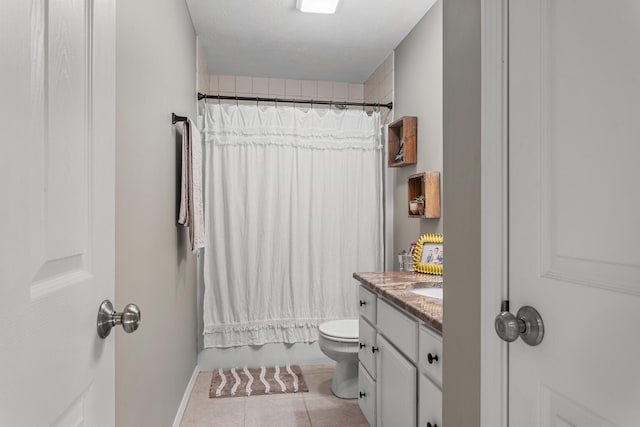 full bath featuring toilet, vanity, shower / bath combo with shower curtain, and tile patterned floors