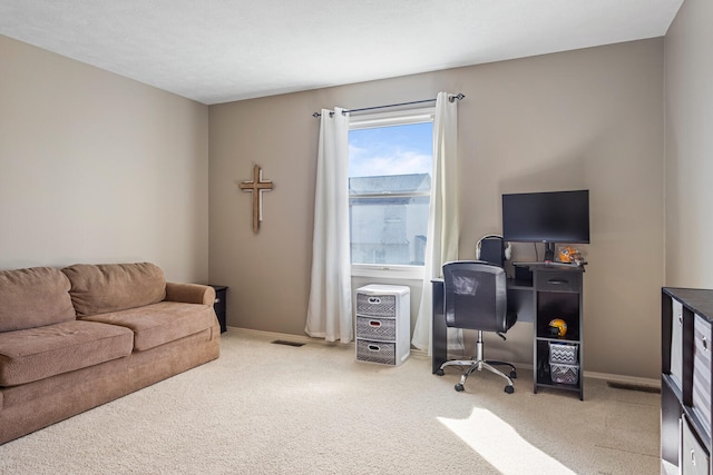 home office with baseboards, visible vents, and carpet flooring