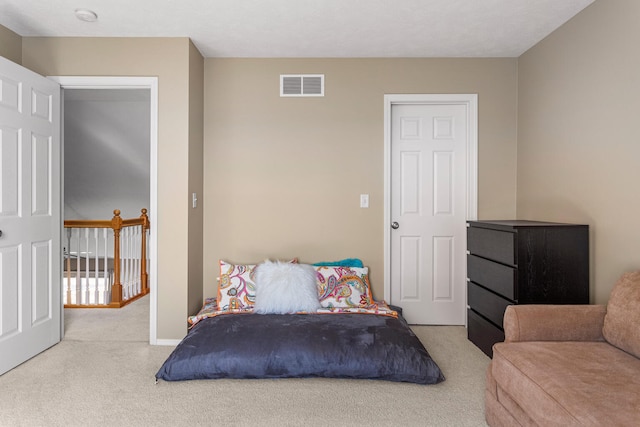 bedroom with carpet and visible vents