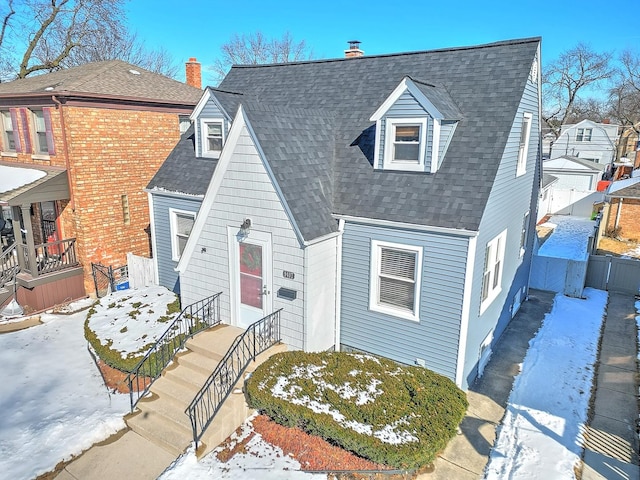 view of front of property with roof with shingles