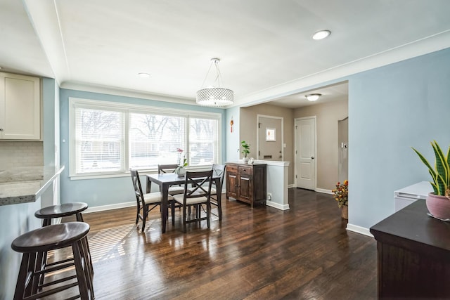 dining space featuring recessed lighting, dark wood finished floors, and baseboards