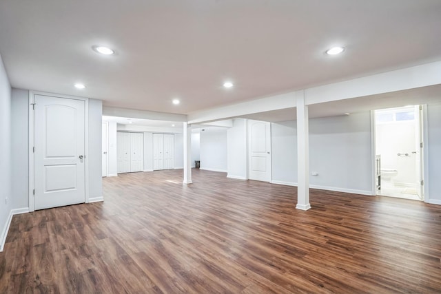 finished basement with baseboards, dark wood-style flooring, and recessed lighting