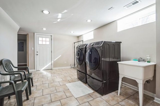 washroom featuring washer and dryer, visible vents, baseboards, and recessed lighting