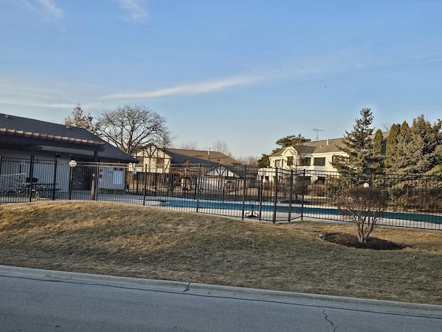 exterior space with fence and a residential view