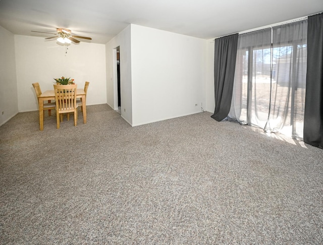 interior space with ceiling fan