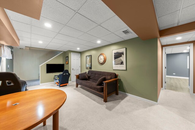 carpeted living area featuring visible vents, recessed lighting, a paneled ceiling, and baseboards