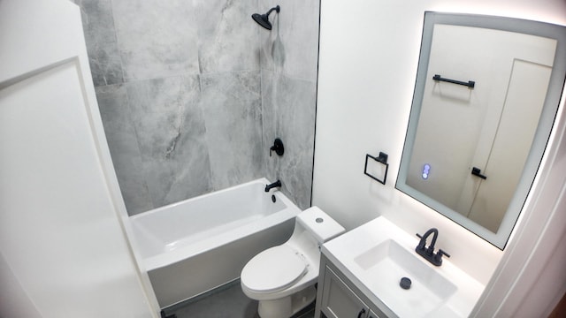 bathroom featuring toilet, shower / bathing tub combination, and vanity