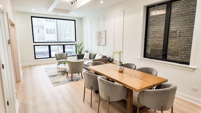 dining area with light wood-style floors, baseboards, and recessed lighting