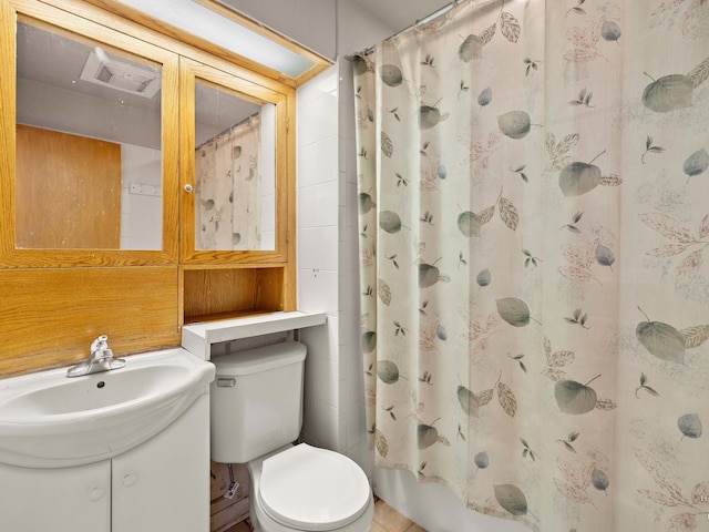 bathroom featuring toilet, visible vents, and vanity